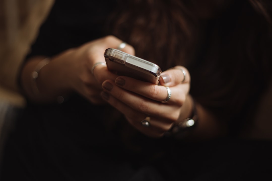 A person checking a messaging app on their phone