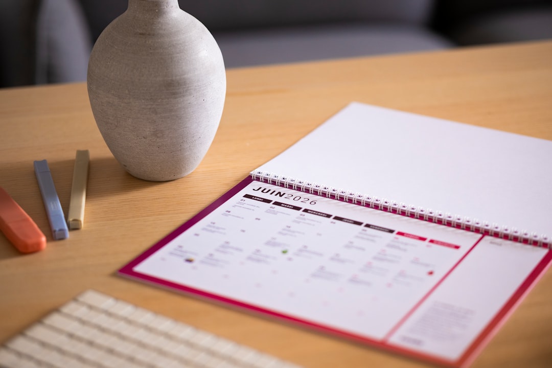 A calendar on a wooden desk